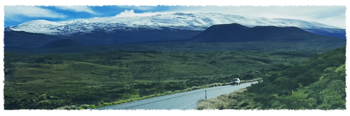 Saddle Road crossing the Big Island of Hawaiʻi with Mauna Kea in the distance