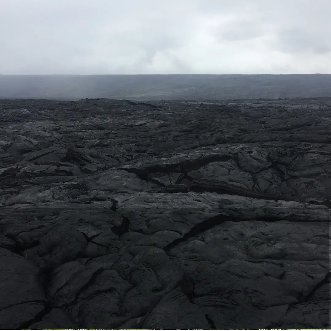 Expansive Kīlauea lava fields on the Big Island of Hawaiʻi, showing hardened black basalt from past volcanic eruptions